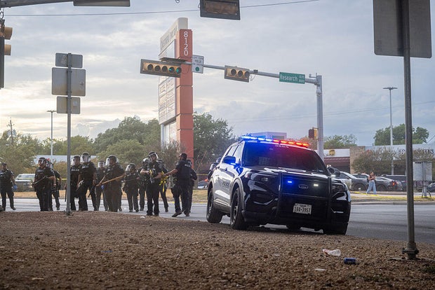 ICE officer who shot Venezuelan man in Texas wasn't wearing a body camera, sources say 2 Law enforcement retreat as people protest against ICE on Sept. 20, 2026 in Austin, Texas.