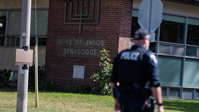 Scene from outside the Sons of Jacob Synagogue where a man armed with a shotgun exchanged gun fire with a police officer stationed outside of the Synagogue late Sunday evening as people were arriving for Yom Kippur. 
