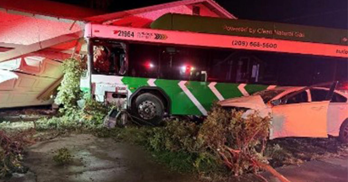 Turlock transit bus crashes into house after collision, leaving 1 dead