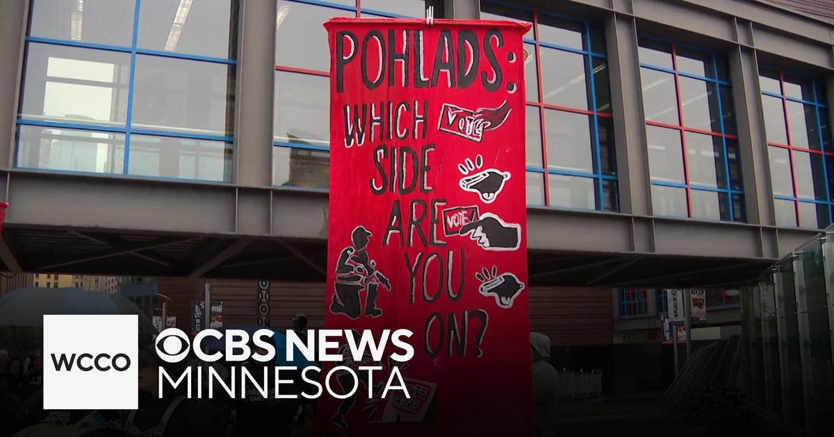 Protesters rally outside Target Field to push Pohlands to "stand up for democracy"