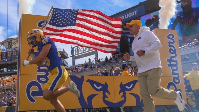 zach-zollers-and-hc-pat-narduzzi-taking-the-field.jpg 