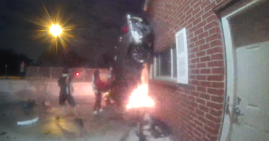 Video shows driver's rescue after car crashes into business, catches ...