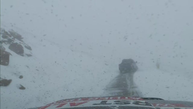 CBS Colorado crew finds accumulating snow on the drive up to the top of Pikes Peak