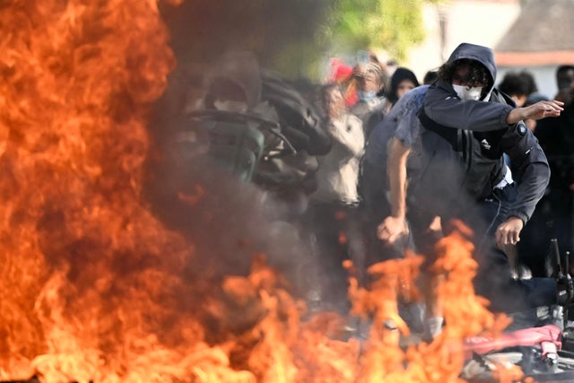 Student protests spread from Paris as violent clashes force hundreds of French high schools to close; movement shows no sign of abating