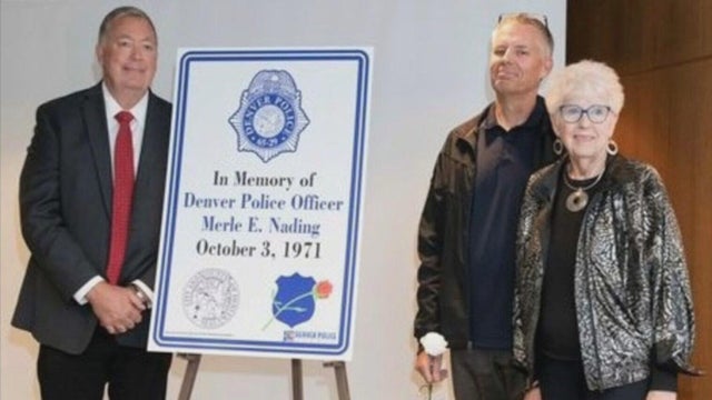 fallen-officer-memorial-sign-1-sons-and-widow-from-denver-police-museum-jpg-frame-0.jpg 