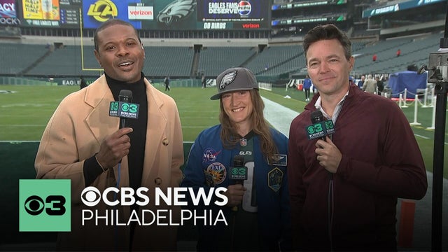 Artemis II astronaut Christina Koch giving the Eagles Super Bowl confetti she brought to space
