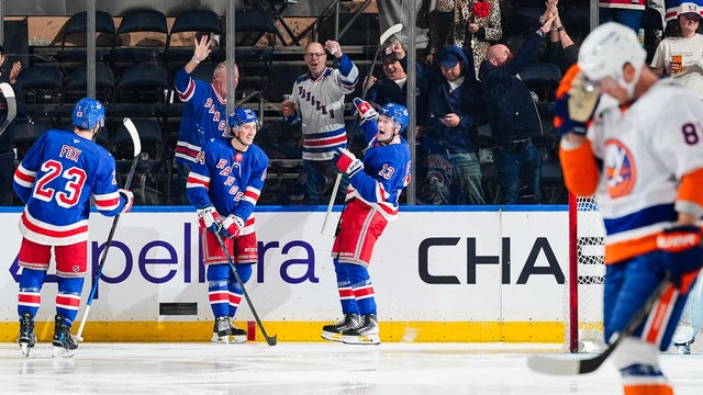 Alexis Lafreniere #13 of the New York Rangers celebrates with teammates after scoring a goal during the second period against the New York Islanders at Madison Square Garden on October 6, 2026 in New York City. 