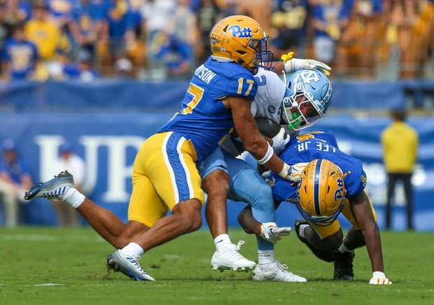 trech-kekahuna-tackled-by-cole-woodson-and-shawn-lee-jr.jpg
