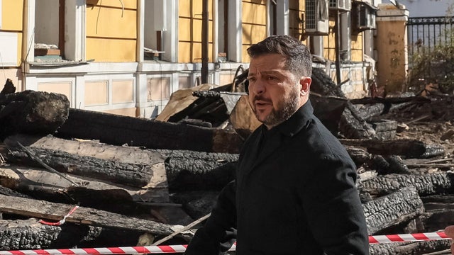 Ukraine's President Volodymyr Zelenskyy views damage from a drone strike in Kyiv 