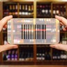 Scanning bar code in retail store using smart phone. Electronic shelf label concept. 