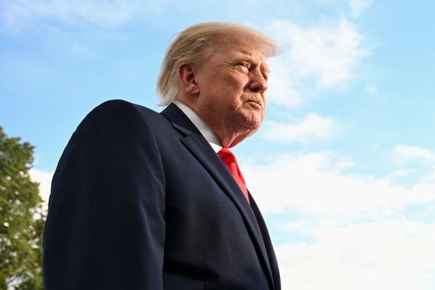 US President Donald Trump departs the White House in Washington