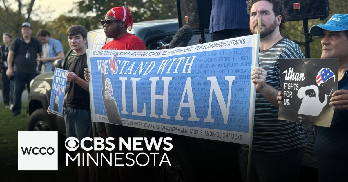 Supporters of Rep. Ilhan Omar rally in Minneapolis after feds search her home