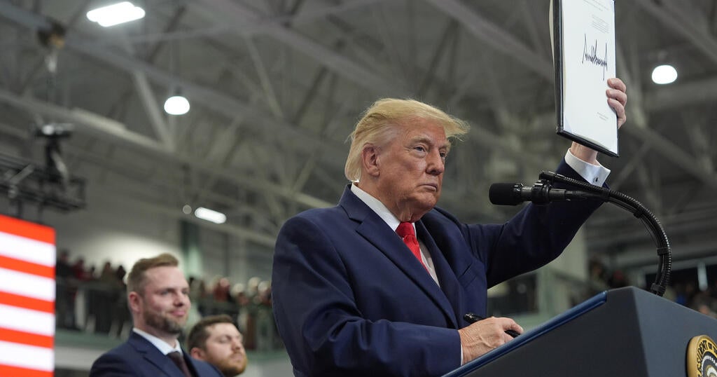 Trump pardons 2 auto workers on stage during rally in Alaska