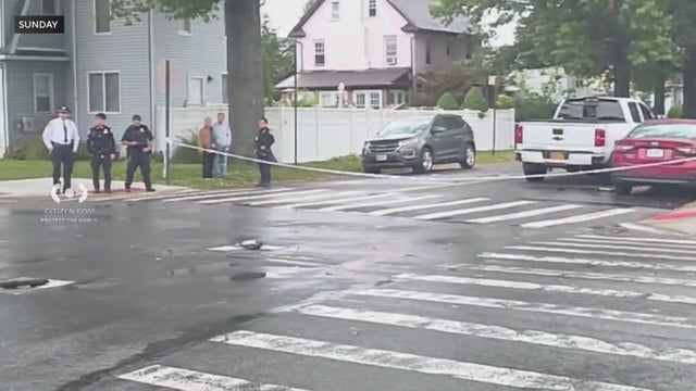 Crime scene tape across a crosswalk 