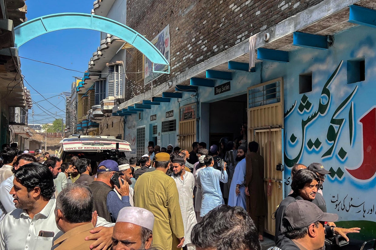 Residents gather during a search operation after a roof collapsed at a school in Peshawar, Pakistan, Oct. 15, 2026. Abdul MAJEED/AFP/Getty