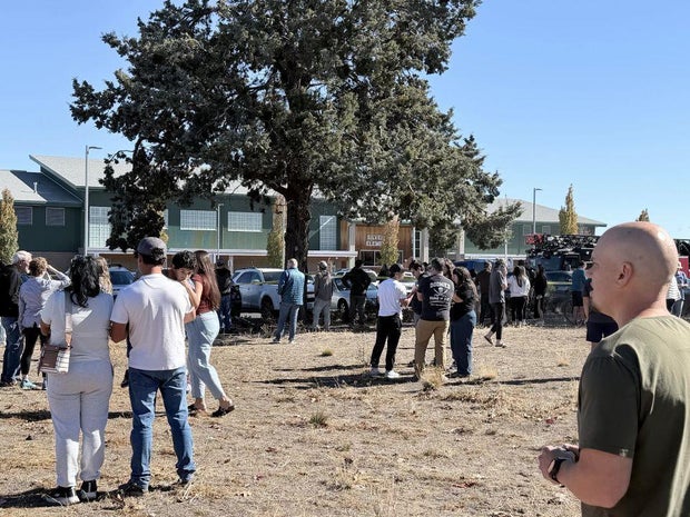 People gather near Silver Rail Elementary School in Bend, Oregon, after reports of a shooting