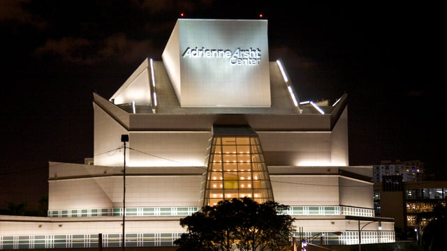 Lit exterior of ziggurat-like arts center 