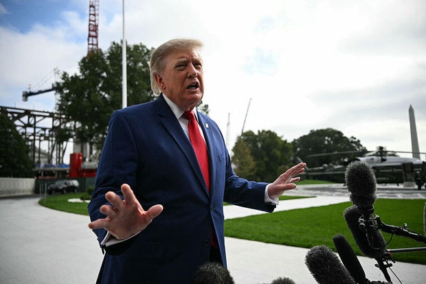President Trump speaks to members of the press before boarding Marine One on the South Lawn of the White House on Oct. 16, 2026. 