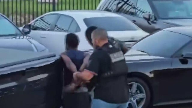 Questions arise over a possible motive in the killing of Miami activist Dwight Wells after arrest