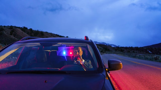 Drunk Driving Man Being Pulled Over by Police 