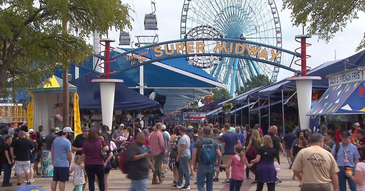 Visitors enjoy food, rides, and games on the final day of the State Fair of Texas