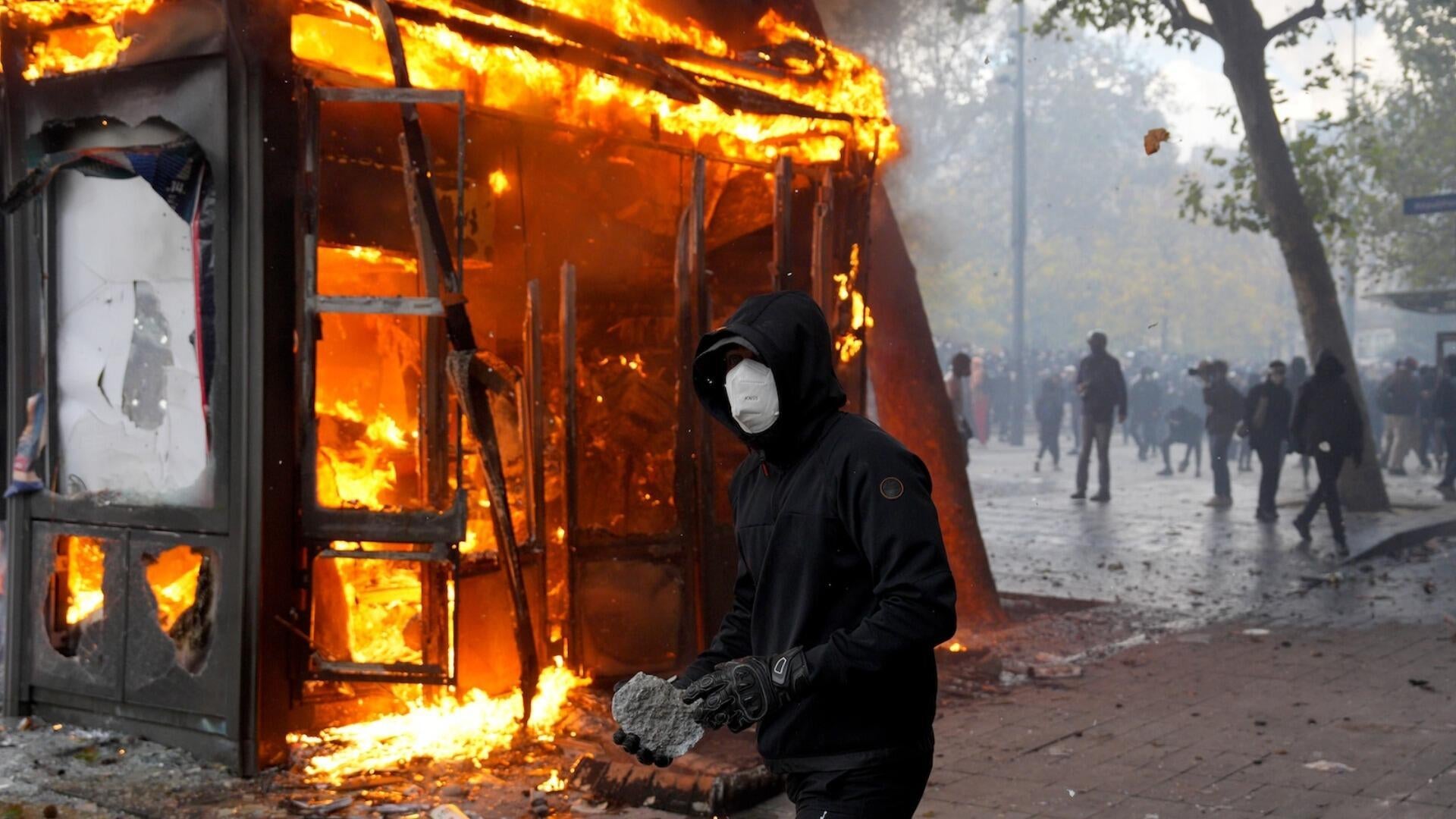 French protests turn violent with looting, torched cars and more
