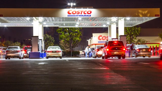 Customers at Costco Gasoline Pump at Night 