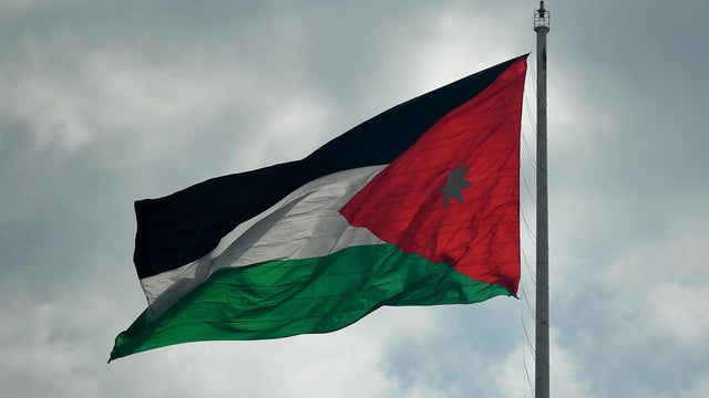 The flag of Jordan flies outside the royal palace of the Hashemite Kingdom of Jordan. 