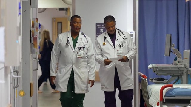 Twin doctors on their climb out of poverty