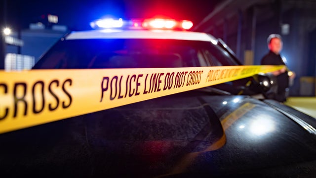 Flashing Lights, Hood of Cop Car, and Police Line Do Not Cross 