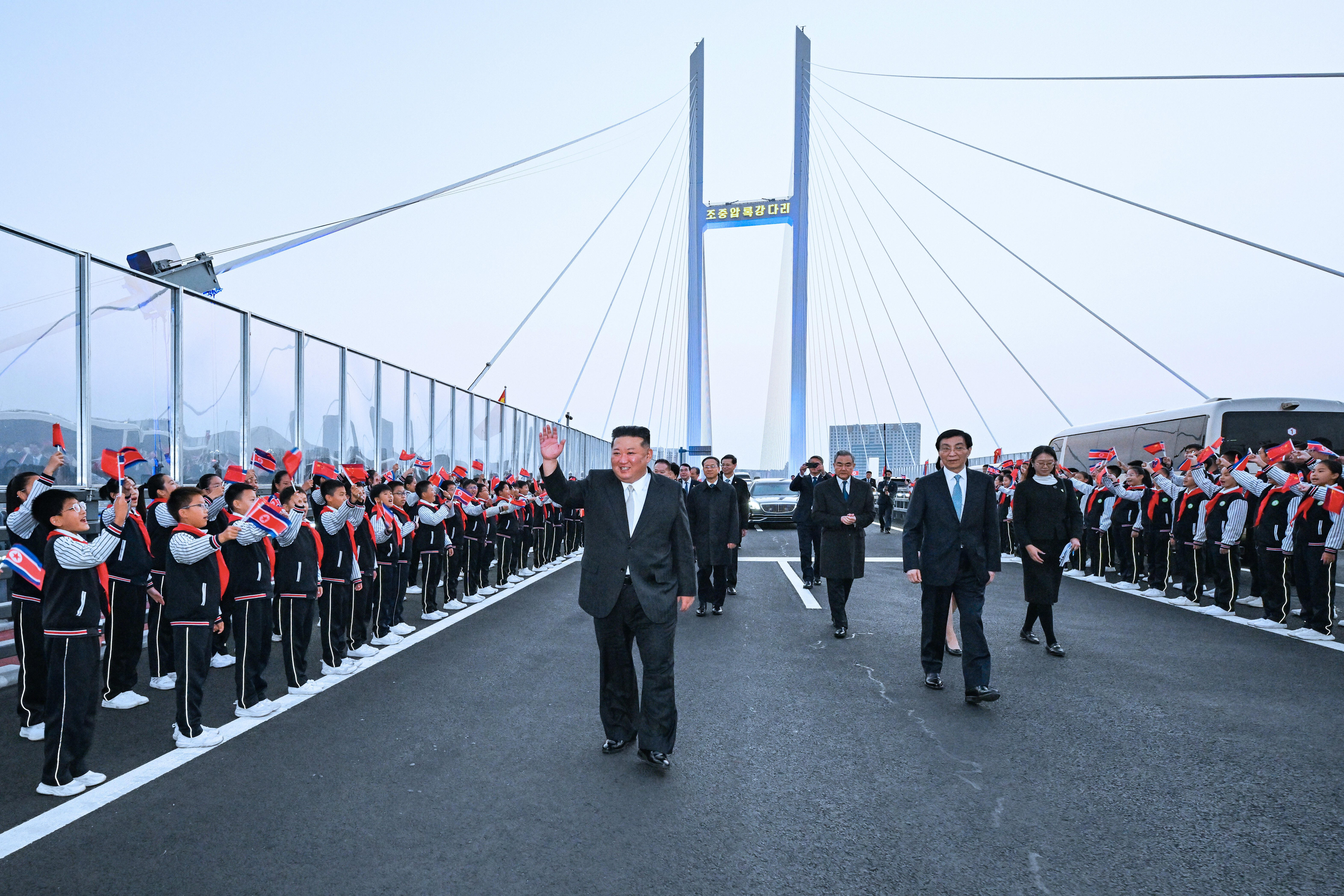 Kim Jong Un visits China to open new bridge, reaffirm ties