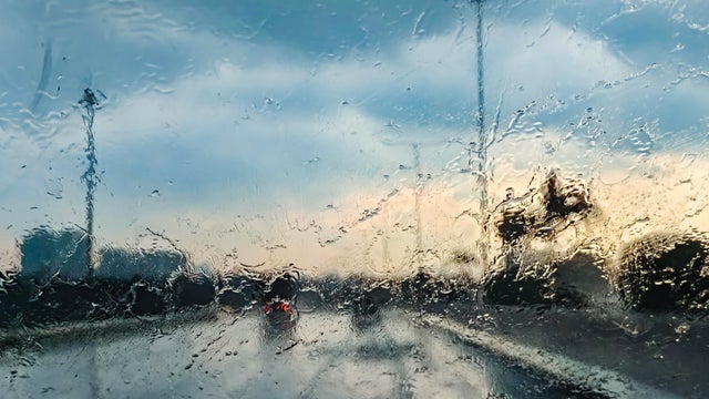 Driving in heavy rain on the freeway on th evening 