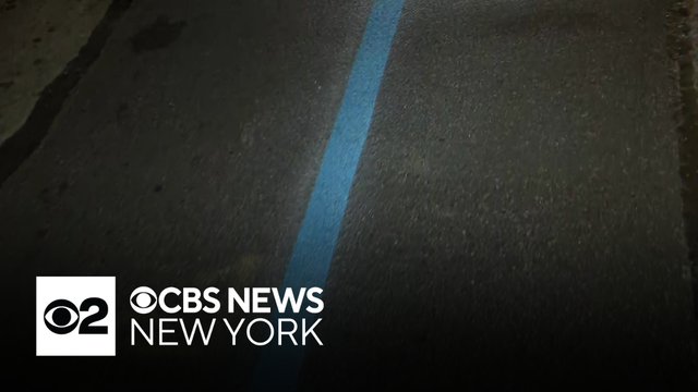 Blue line painted across NYC to mark official marathon route