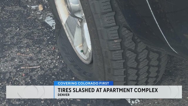 Police are investigating the slashing of many tires at a Denver apartment building
