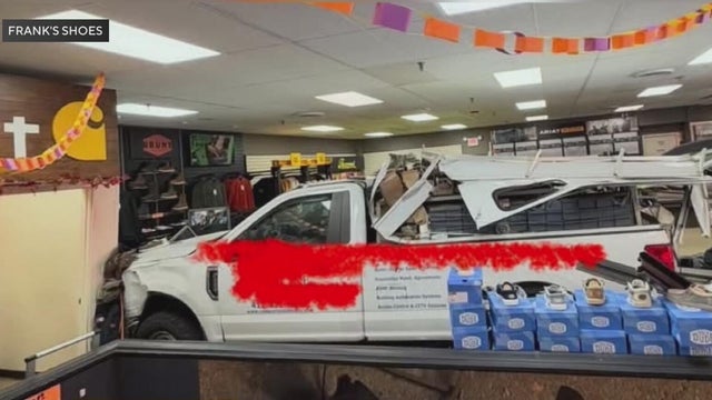 Video shows moment truck rolls down hill and crashes into store