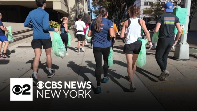Volunteers pick up trash along TCS NYC Marathon course