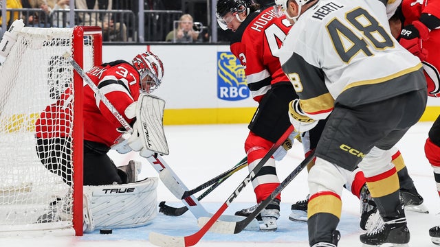 Connor Hellebuyck #37 of the New Jersey Devils seals the post as he and Luke Hughes #43 defend the net against Tomas Hertl #48 of the Vegas Golden Knights in the second period at T-Mobile Arena on October 30, 2026 in Las Vegas, Nevada. 