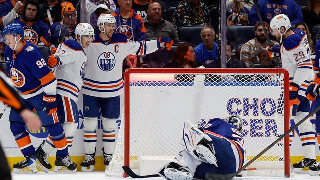 Ryan Nugent-Hopkins #93 of the Edmonton Oilers celebrates his second goal of the second period against Ilya Sorokin #30 of the New York Islanders with teammates Connor McDavid #97 and Leon Draisaitl #29 at UBS Arena on October 31, 2026 in Elmont, New York. 